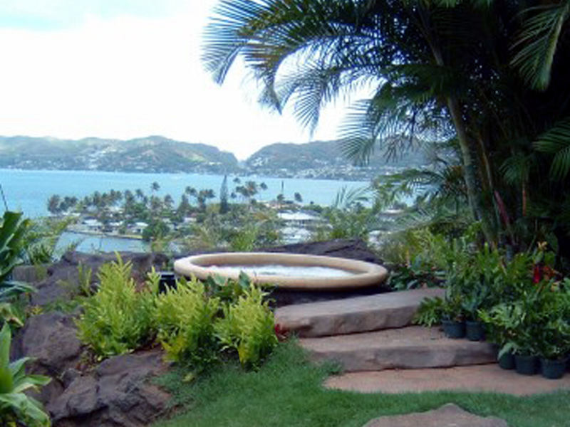 entertainment area with outdoor wet bar, lush plant life laid out for entertaining by PLD